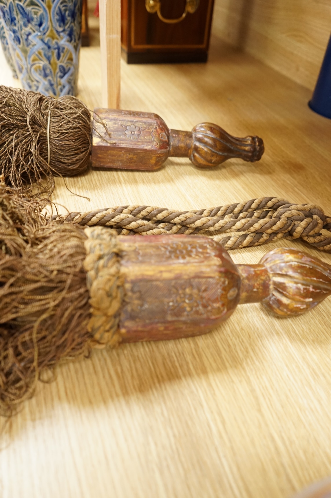 A pair of 19th century Venetian carved wood and tasseled tie-backs